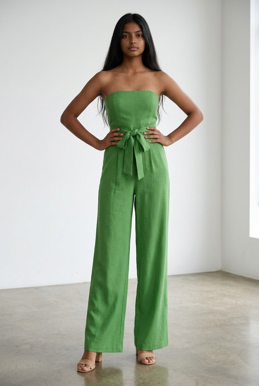 Green strapless wide-leg jumpsuit with tied waist and fitted bodice, front view