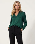 Women’s long-sleeve blouse in deep green with button front and collared neckline