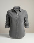 Slim fit long-sleeve button-up shirt in dark gray with chest pocket and button placket