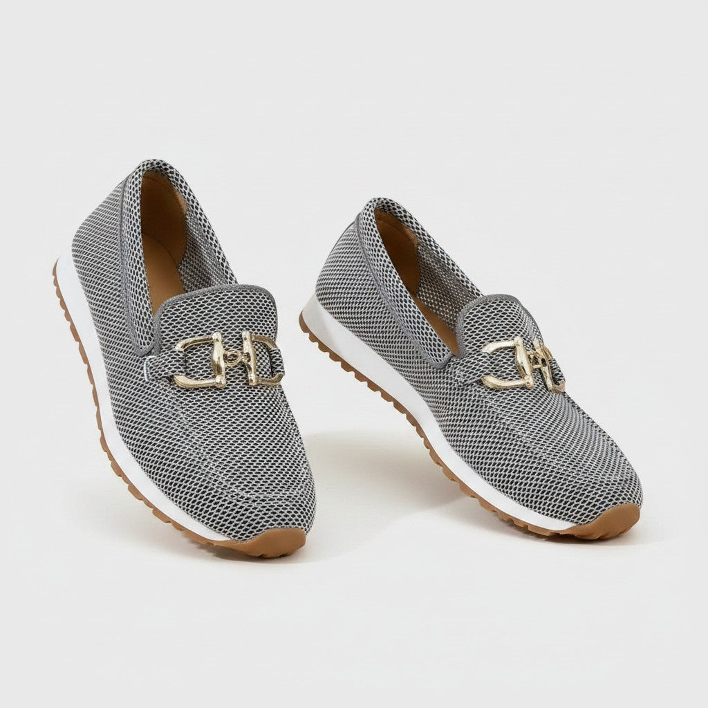 Gray woven slip-on loafers with gold bit hardware and light tan rubber sole.