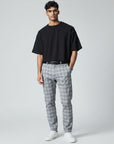 Light gray plaid slim-fit ankle-length trousers with belt loops and button fly