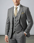 Gray men’s three-piece suit set with tailored jacket, waistcoat, and matching trousers