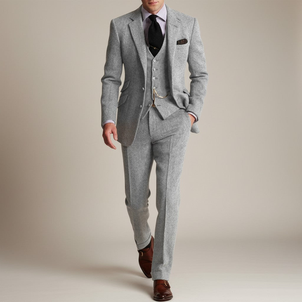 Grey tweed three-piece suit with vest and trousers, single-breasted blazer and pocket square
