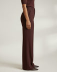 High-waist tailored trousers in deep plum, side view, with belt loops