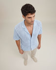 Men's light-blue knit short-sleeve button-up shirt, open collar, textured fabric