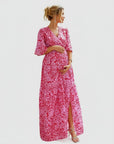 Floral chiffon maternity maxi dress, pink-and-white print, V-neck, bell sleeves, front slit