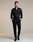 High-waisted tailored trousers in black, belt detail and pleated front creases