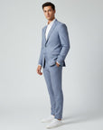 Light blue men's slim-fit linen suit, side view with blazer and matching trousers.