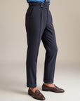 Men's high-waisted straight-leg tailored trousers in dark navy, full side view
