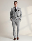 Grey tweed three-piece suit with matching vest and trousers, single-breasted blazer, pocket square