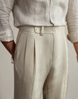 High-waisted tailored trousers in beige, front pleats and belt-loop waist