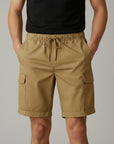 Men's tan cargo shorts with drawstring waist and side cargo pockets