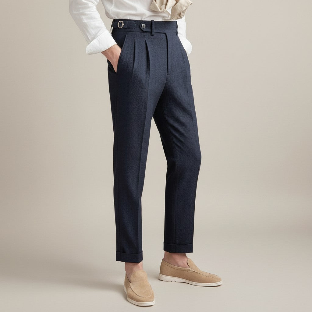 High-waisted tailored trousers in dark navy, pleated front, belt loops