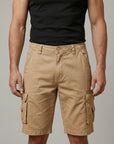 Men's cargo shorts, tan with elastic waist and flap cargo pockets, knee length.