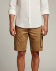 Men's beige cargo shorts with flap pockets and belt loops