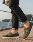 Men's dark green driving loafers with lace-up front and white rubber flat sole