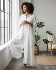 Women’s white oversized cotton-linen jumpsuit with button front and long sleeves