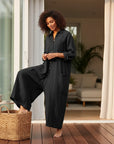 Women’s black oversized cotton-linen jumpsuit with button front and relaxed wide legs