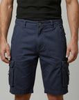 Men's cargo shorts, navy blue with elastic waist and flap cargo pockets.