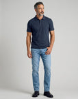 Men's navy cotton polo shirt with front button placket and short sleeves