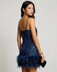 Dark blue sequin mini dress with feather hem trim and spaghetti straps