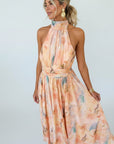 Women’s halter maxi dress with pastel floral print, sleeveless and gathered waist