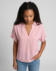 Light pink lightweight chiffon blouse with V-neck and short draped sleeves