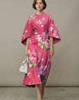 Pink floral wrap midi dress with kimono sleeves and tied waist