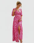 Floral chiffon maternity maxi dress, pink-and-white print, V-neck, gathered waist, front slit