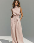 Pink sleeveless high-neck tank top and wide-leg trousers set, draped waist