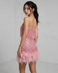 Pink sequin mini dress with spaghetti straps and feather fringe hem