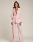 Light pink tailored suit with V-neck blazer and wide-leg trousers, long sleeves