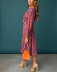 Purple patterned maxi A-line dress with V-neck, tie waist, long sleeves