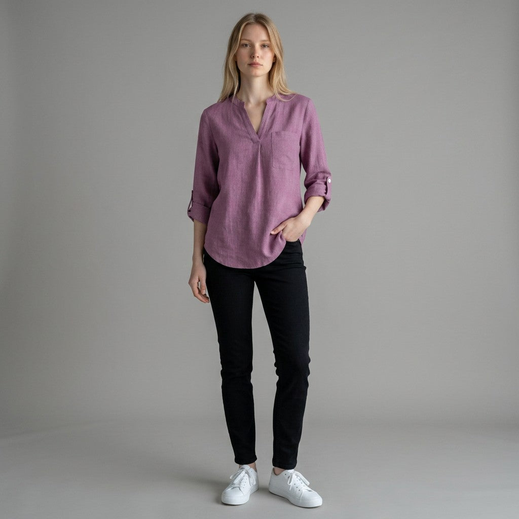 Mauve purple linen blouse with V-neck and button placket, three-quarter sleeves rolled up.