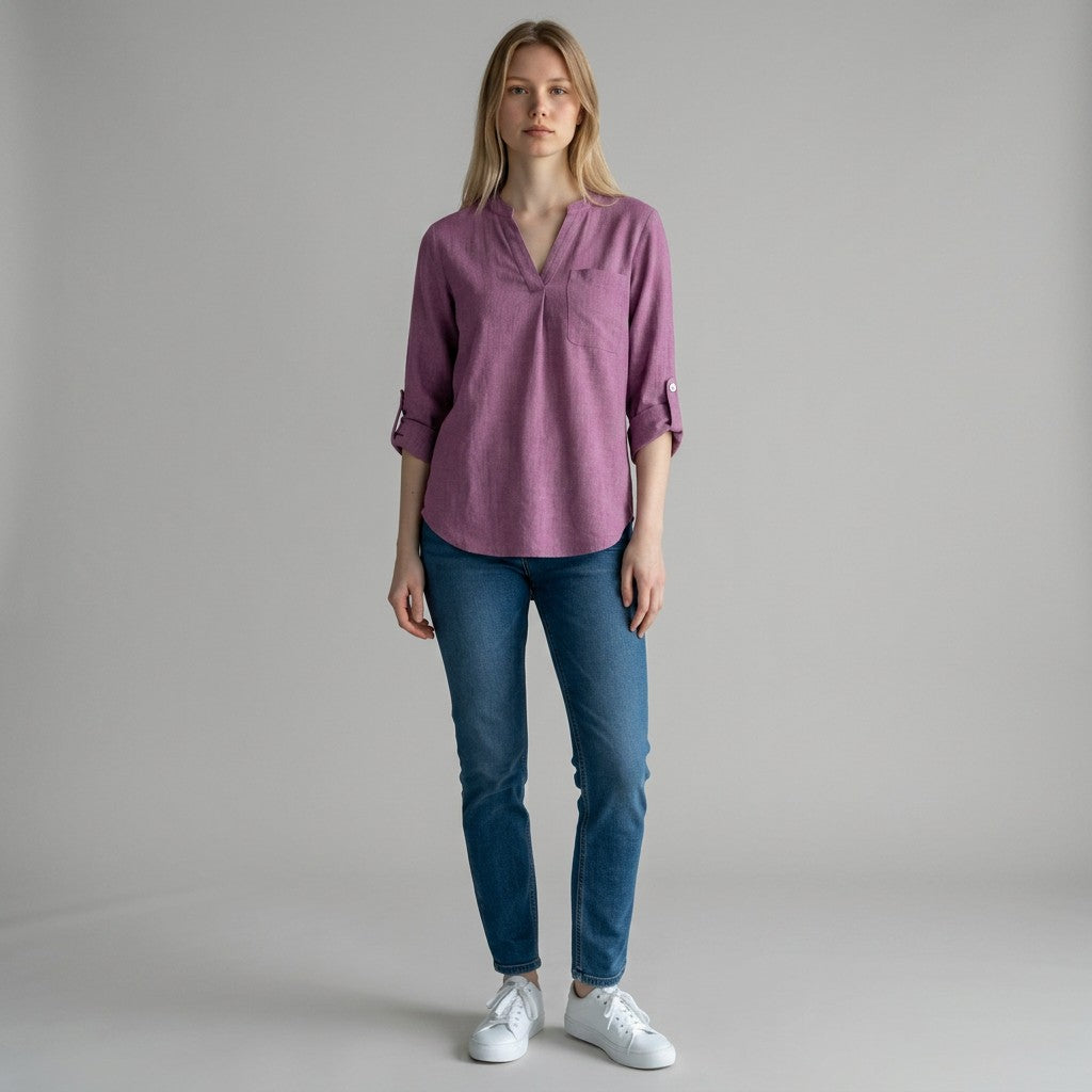 Purple linen blouse with V-neck and small button placket, three-quarter sleeves rolled up.