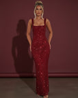 Embellished evening gown with square neckline, sleeveless straps, and long column fit in deep red.