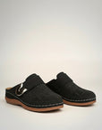 Black slip-on orthopedic slippers with metal buckle strap and perforated upper.
