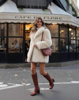 Cream teddy fleece jacket with high collar, side view