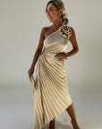 Beige pleated one-shoulder maxi dress with rosette detail at the shoulder