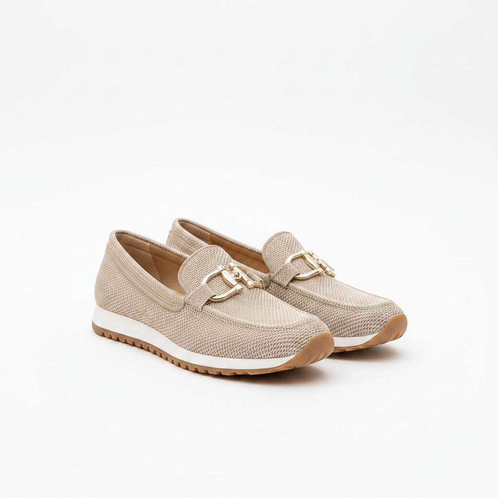 Light beige textured slip-on loafers with gold bit hardware and tan rubber sole.