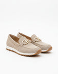 Light beige textured slip-on loafers with gold bit hardware and tan rubber sole.