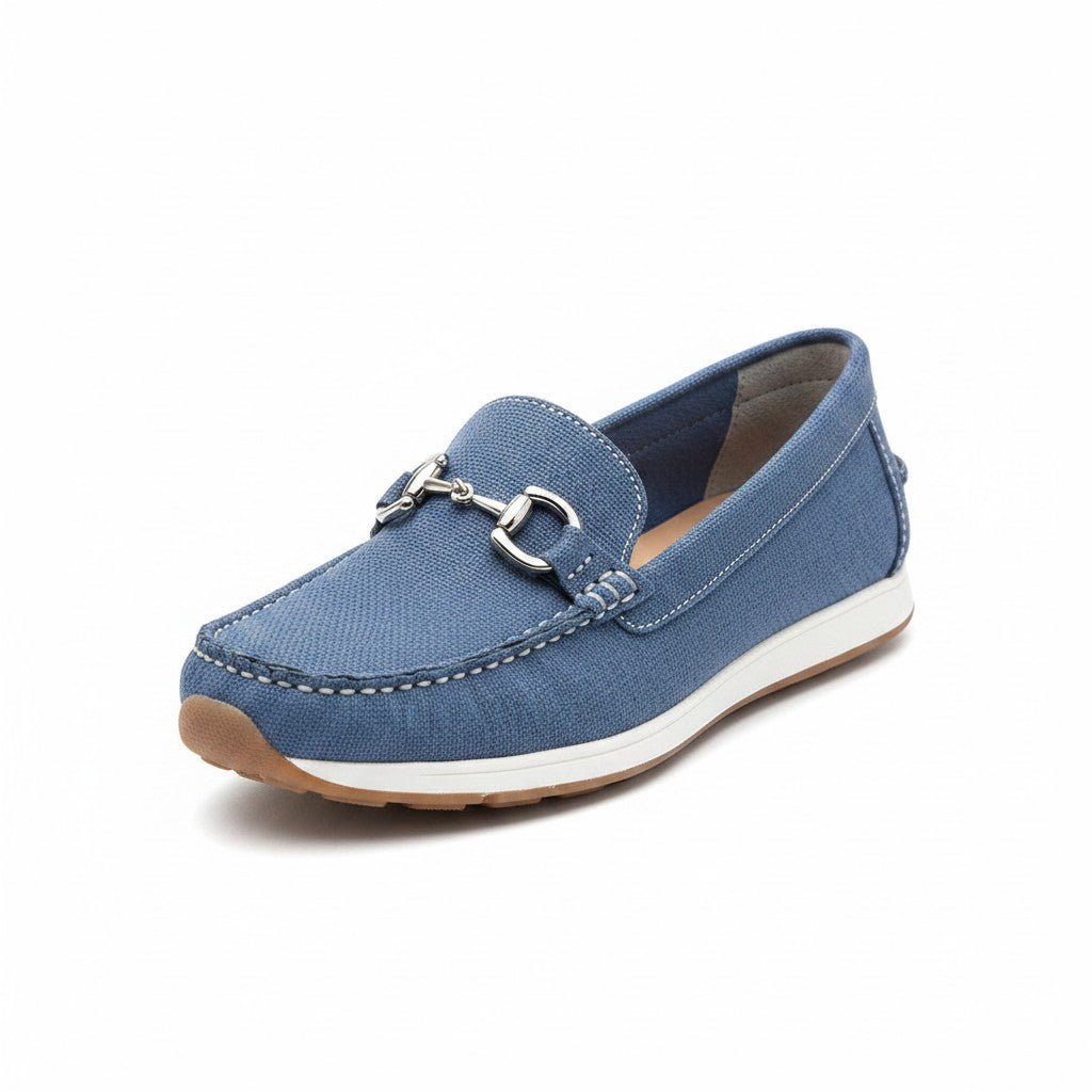 Blue fabric slip-on loafers with gold metal bit detail and white midsole.