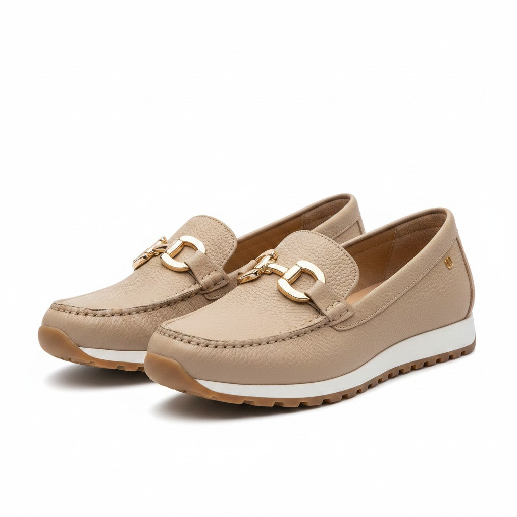 Beige slip-on loafers with gold metal bit detail, stitched seams, cushioned sole.