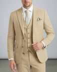 Beige three-piece suit set with tailored jacket, waistcoat, and matching trousers