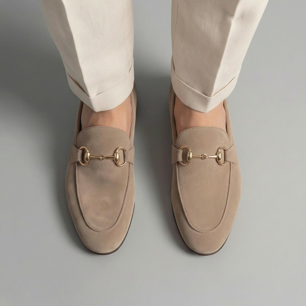 Beige suede loafers with horsebit detail close-up, almond toe slip-on