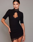 Black high-collar bodycon dress with half sleeves and lace appliqué neckline and hem.
