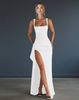 White evening maxi dress with square neckline and thigh-high side slit