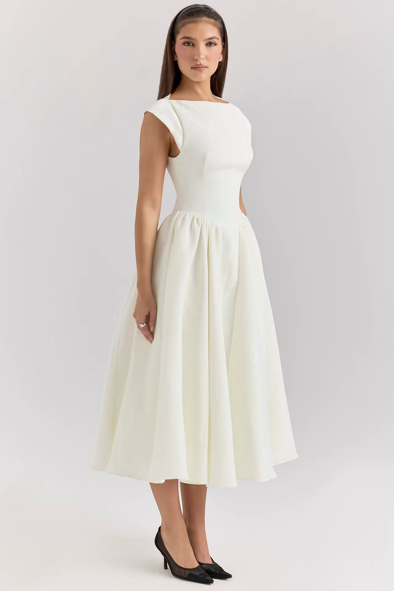 White cap-sleeve midi dress with fitted waist and A-line gathered skirt