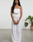 White strapless jumpsuit with wide-leg pants and tied waist, front view