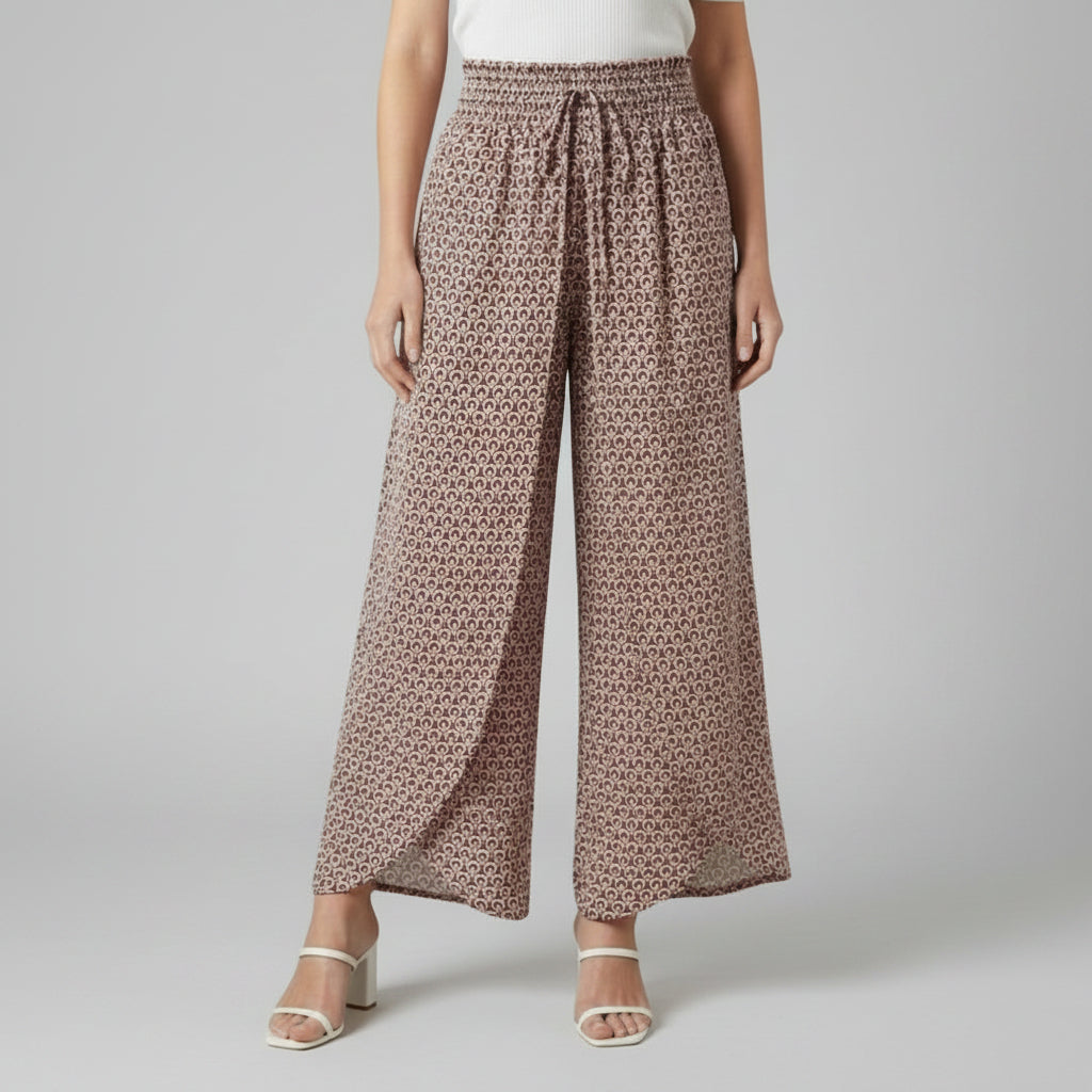 Beige printed wide-leg trousers with elastic waistband and gathered tie waist